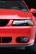 2003 Ford Mustang - Front view of a red 2003 Ford Mustang, showing headlights, grille, and fog lights.