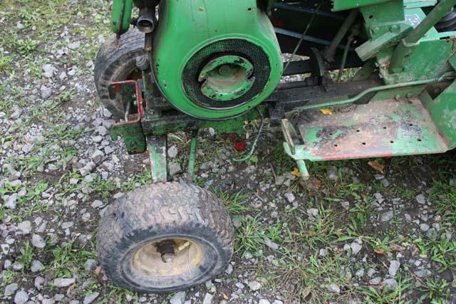 Green riding mower engine and front wheel