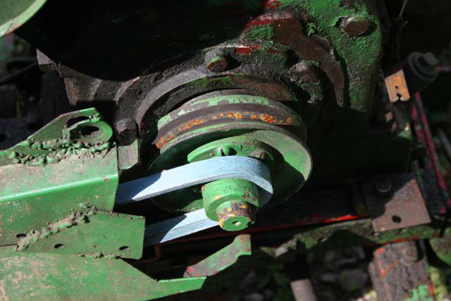 Green engine pulley with a blue belt