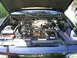 2003 Mercury Marauder - The engine bay of a black 2003 Mercury Marauder is visible with the hood open.