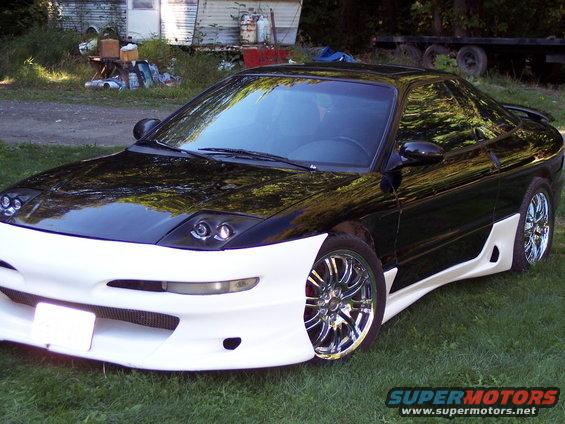 1996 Ford Probe, black and white with custom body kit, 3/4 front view