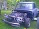 2002 Ford Crown Victoria - This truck's front end is disassembled, revealing the engine and chassis components.
