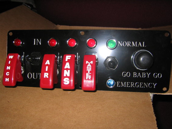 picture-025.jpg I bought this from 12 volt guy.com

Now I will have control of the winch, the onboard air when i get it, fans, ignition, dual batteries, and I will have a push to start button which I personally requested and like the "Go - Baby - Go" caption! Hahaha!