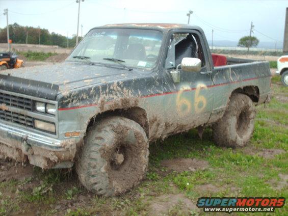 Mud-covered 1991 Chevrolet Blazer with number 66 on the side, 3q-front view
