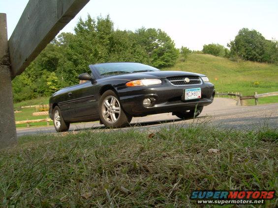 Black 1996 Chrysler Sebring convertible parked on a road