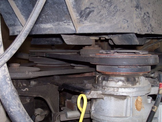 close-up of engine belts and pulleys