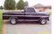 2002 Ford Crown Victoria - This black Ford pickup truck has a Ranger XLT badge and chrome accents.