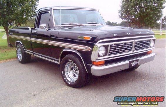 Black Ford pickup truck with chrome trim and wheels. Has a "Ford" badge on the hood and a hog emblem on the front bumper