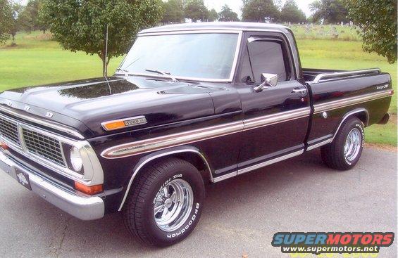 Black Ford F-Series pickup truck with chrome trim and custom wheels