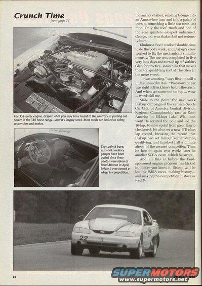 White 1995 Ford Mustang race car with number 22 on the door, seen from a 3/4 front angle on a track