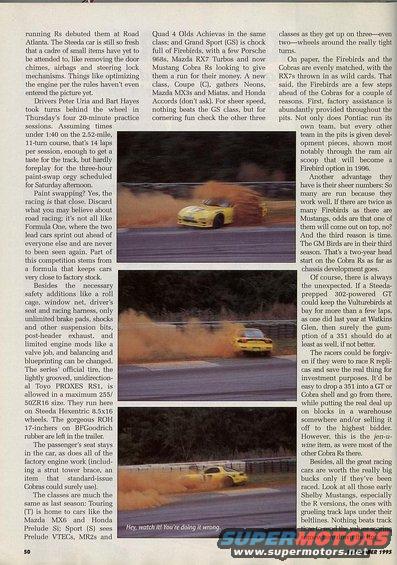 Yellow sports car drifting on a track, kicking up orange dust