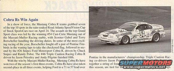 1995 Ford Mustang Cobra R race car with sponsor decals on a track