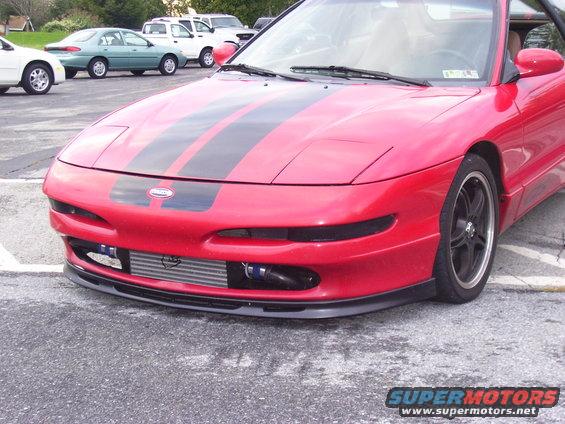 1997 Ford Probe front view, red with black racing stripes, aftermarket intercooler visible