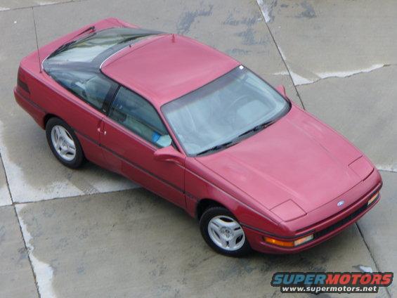 Red 1991 Ford Probe coupe parked on concrete