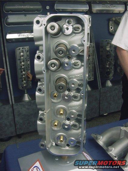Aluminum engine cylinder head with visible valves and springs