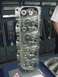 1990 Ford Mustang - Close-up view of an aluminum engine cylinder head, its internal components like valves and springs.