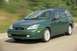 2002 Ford Focus - This 2002 Ford Focus wagon is captured in motion on a road, its green exterior.