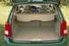 2002 Ford Focus - The rear cargo area and interior of a green wagon are visible with the trunk open.