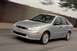 2002 Ford Focus - Silver 2002 Ford Focus sedan captured in motion on a paved road.