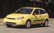2002 Ford Focus - A yellow 2000 Ford Focus hatchback is shown from the front three-quarter angle.