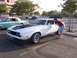 2002 Ford Mustang - White 1971 Ford Mustang with black hood scoop and spoiler parked next to another classic car.