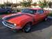 2002 Ford Mustang - Orange 1970 Ford Mustang Boss 302 with black stripes, parked next to a grey convertible.