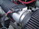 1989 Ford Bronco - Close-up of a Ford mass air flow sensor, part of the vehicle's air intake system.