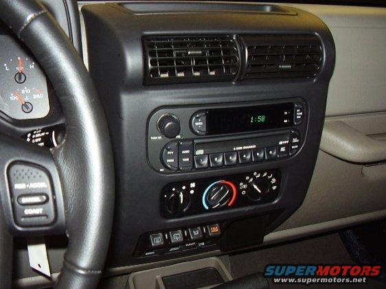 2000 Jeep TJ interior showing dashboard, radio, and steering wheel controls