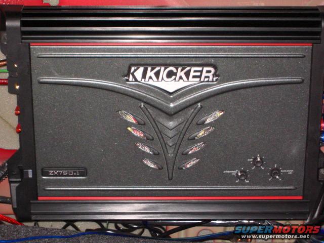 Kicker ZX750.1 amplifier with red trim and control knobs
