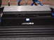2003 Ford Crown Victoria - Alpine car amplifier with heatsink fins and visible wiring.