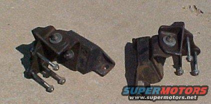 two rusty engine mounts on concrete