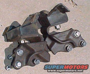 Engine mounts with bolts on a concrete surface