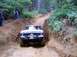 1976 Ford F-100 - Ford F-100 navigates a challenging muddy off-road trail.