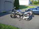 2006 Suzuki SV1000S - Side view of a 2006 Suzuki SV1000S motorcycle parked on a driveway.