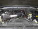 1990 Chevrolet Suburban - The engine bay shows an aftermarket air intake system installed on the vehicle.