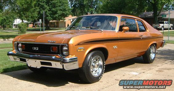 Orange 1973 Chevrolet Nova SS with black racing stripes parked on a driveway