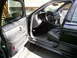 2003 Mercury Marauder - The interior of a 2003 Mercury Marauder is visible with the driver's side door open.