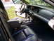 2003 Mercury Marauder - The interior of a car is shown, black leather seats and the dashboard area.