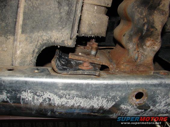 Tow hook mounting bracket with rust and bolts
