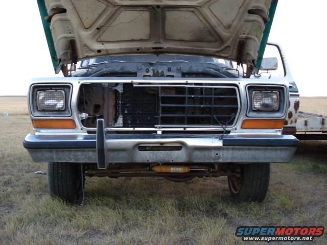 Front of a 1979 Ford Bronco with hood open, grille visible