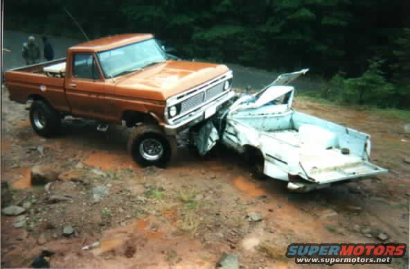 1976 Ford F-100 front end smashed into a white pickup truck's rear