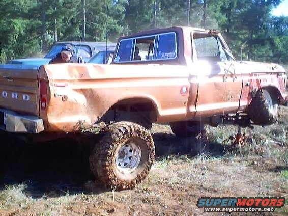 4x4war_0054.jpg I was balancing on my right side for a second.  I suspect the right side ball joints took on most the weight of the truck and pulled out, breaking the axle shaft and sending me the rest of the way over.

4x4 Wars October 2002.