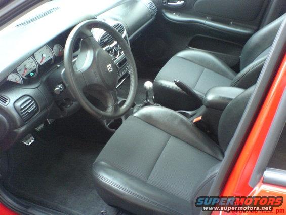 Interior view of 2005 Dodge SRT-4 showing dashboard, steering wheel, and seats