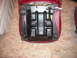 1979 Ford Bronco - The underside of a red car seat shows a stamped date of 9.15.78.
