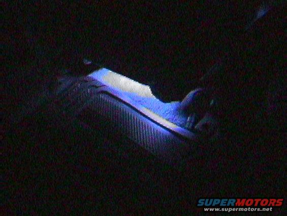 Dashboard with blue ambient lighting and textured surface