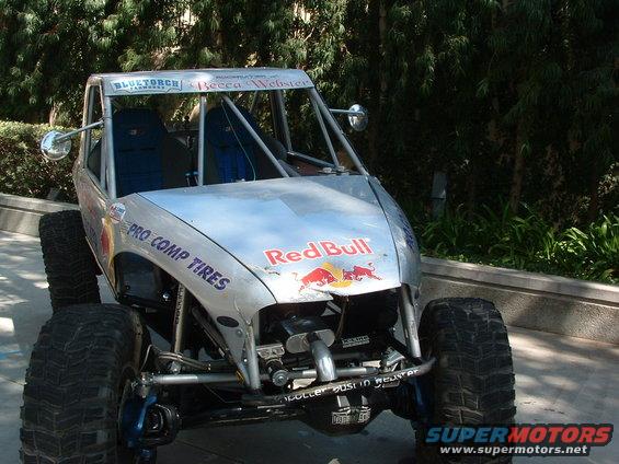 Off-road buggy with Red Bull and Pro Comp Tires logos, front view