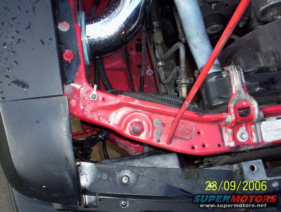 Engine bay with red bracing and chrome intake pipe