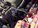 1990 Ford Mustang - A detailed view of the engine compartment, showing complex mechanical components and wiring.