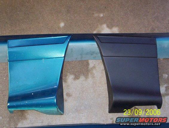 Two car door trim pieces, one teal and one black, laid out on a concrete surface