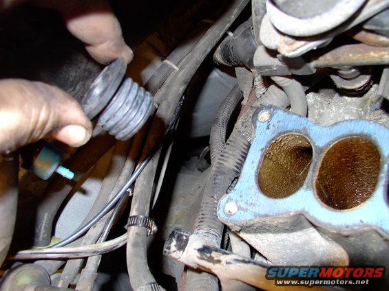 img_0048.jpg New PCV valve grommet going in.